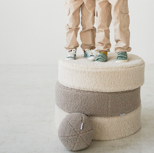 kids standing on boucle poufs by bettys home with boucle ball in taupe