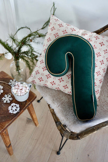 christmas candy cane cushion on chair as christmas living room decoration. christmas candy cane pillow green by bettys home