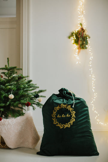 christmas sack large in velvet green next to the Christmas tree by Bettys Home. Green Christmas Bag for gifts