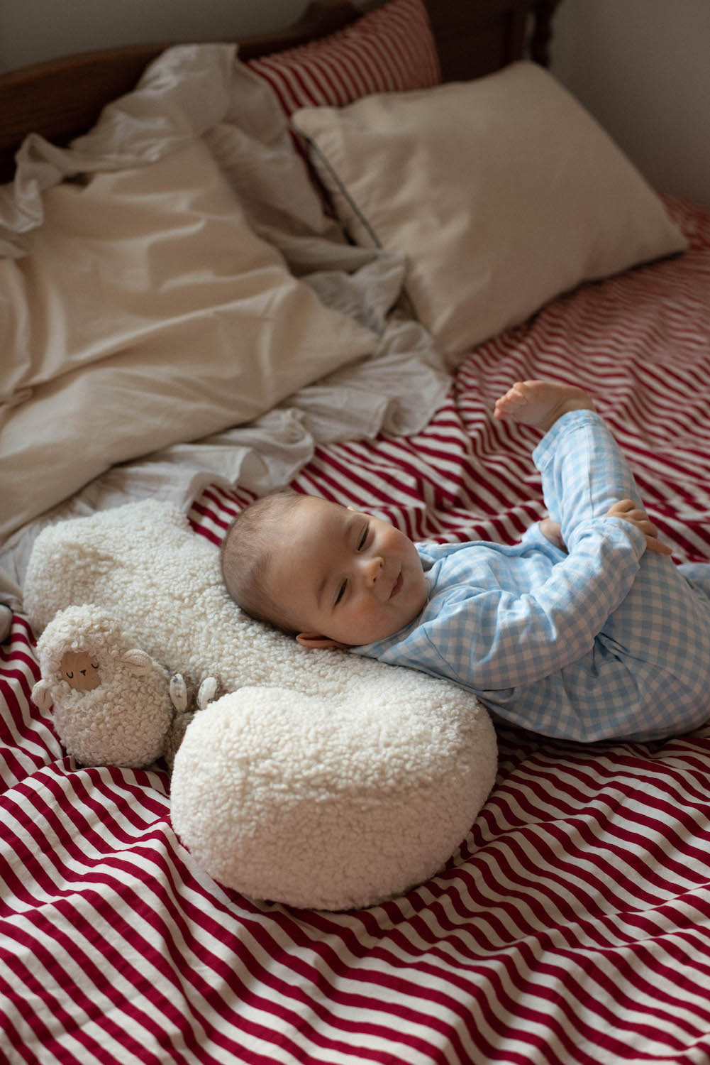 cuteye little baby lying on Boucle letter cushion J teddy pillow by bettys home 