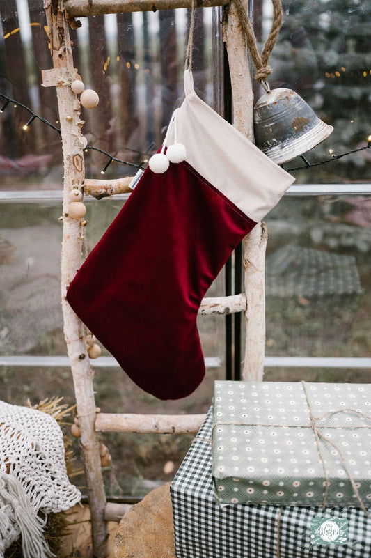 christmas stocking in wine red by Bettys Home on wooden ladder as christmas decoration 
