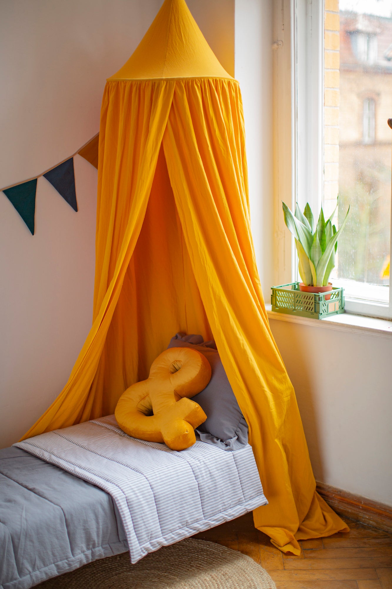Velvet Letter Cushion & by Bettys Home on kids bed under beautiful yellow canopy and garland. Birthday present ideas for her