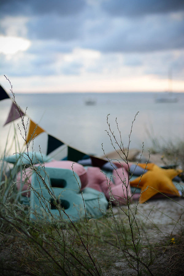 beach view with velvet garland and velvet letter pillow b mint by Bettys home