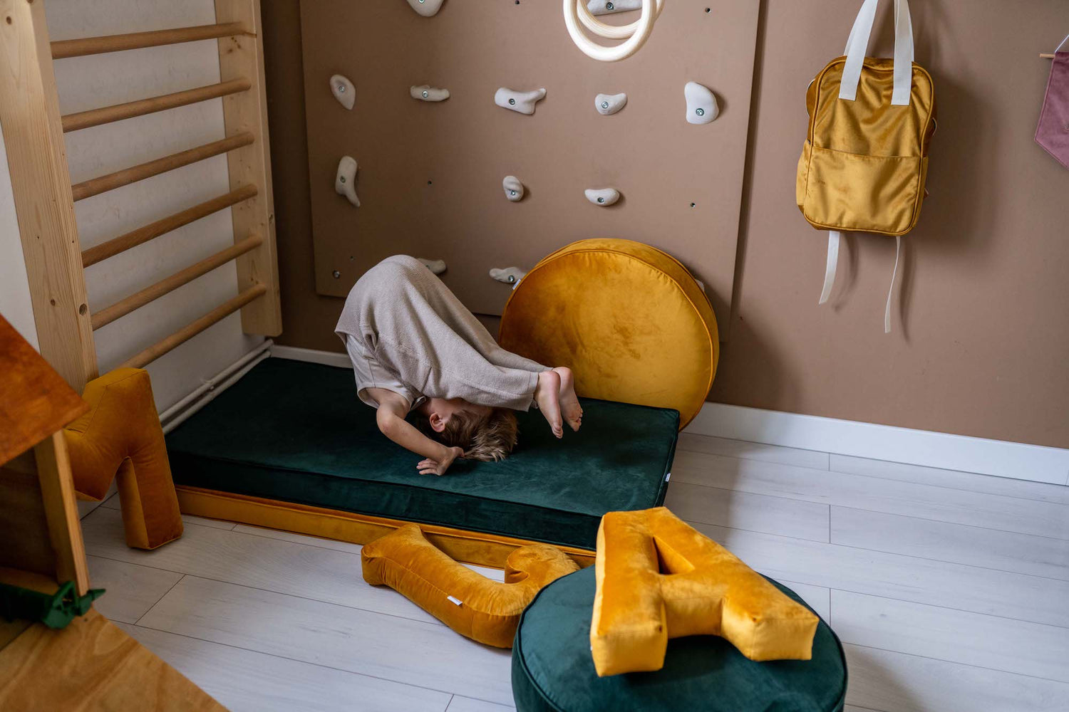 boy in gymnastic room on velvet mattress by bettys home near to velvet letter cushion a in yellow