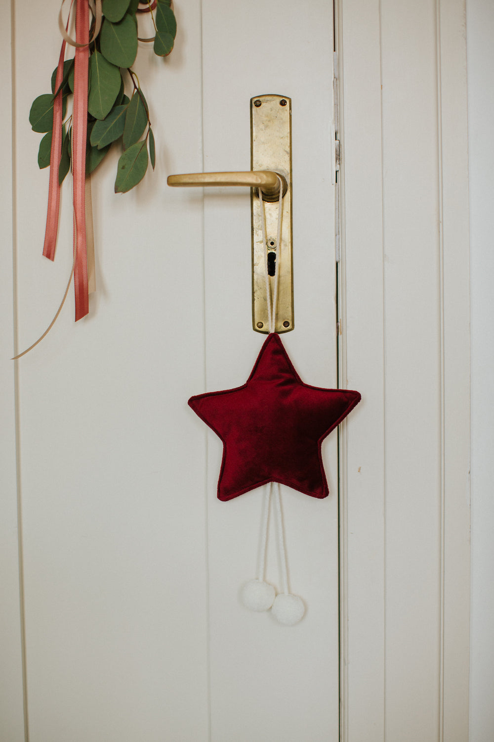 velvet little star pendant wine red by  bettys home hanging on the door handle as christmas decoration