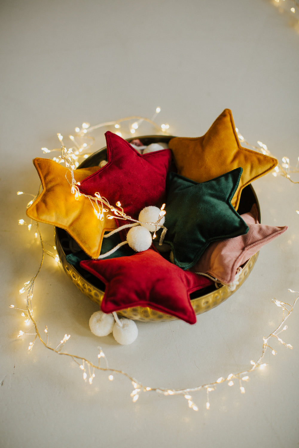 velvet little star pendant yellow with pompoms by bettys home in three colours in basket with christmas lights